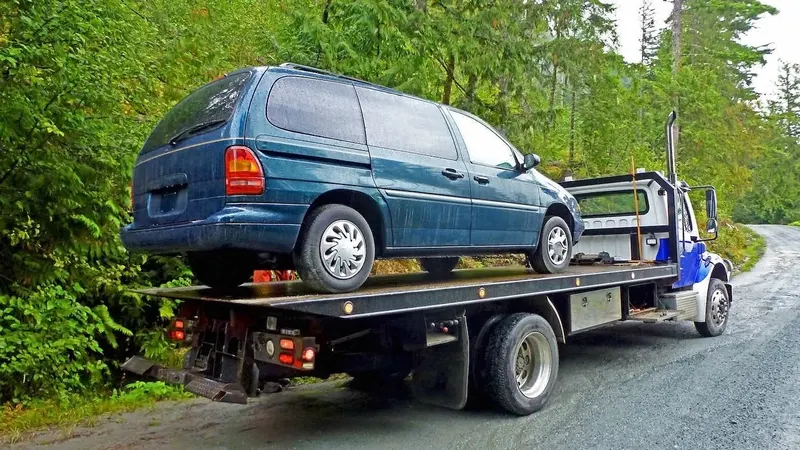 Windsor flatbed towing a cargo van