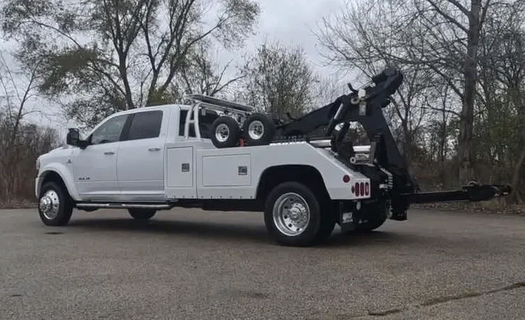 Windsor wrecker equipment securing damaged vehicle